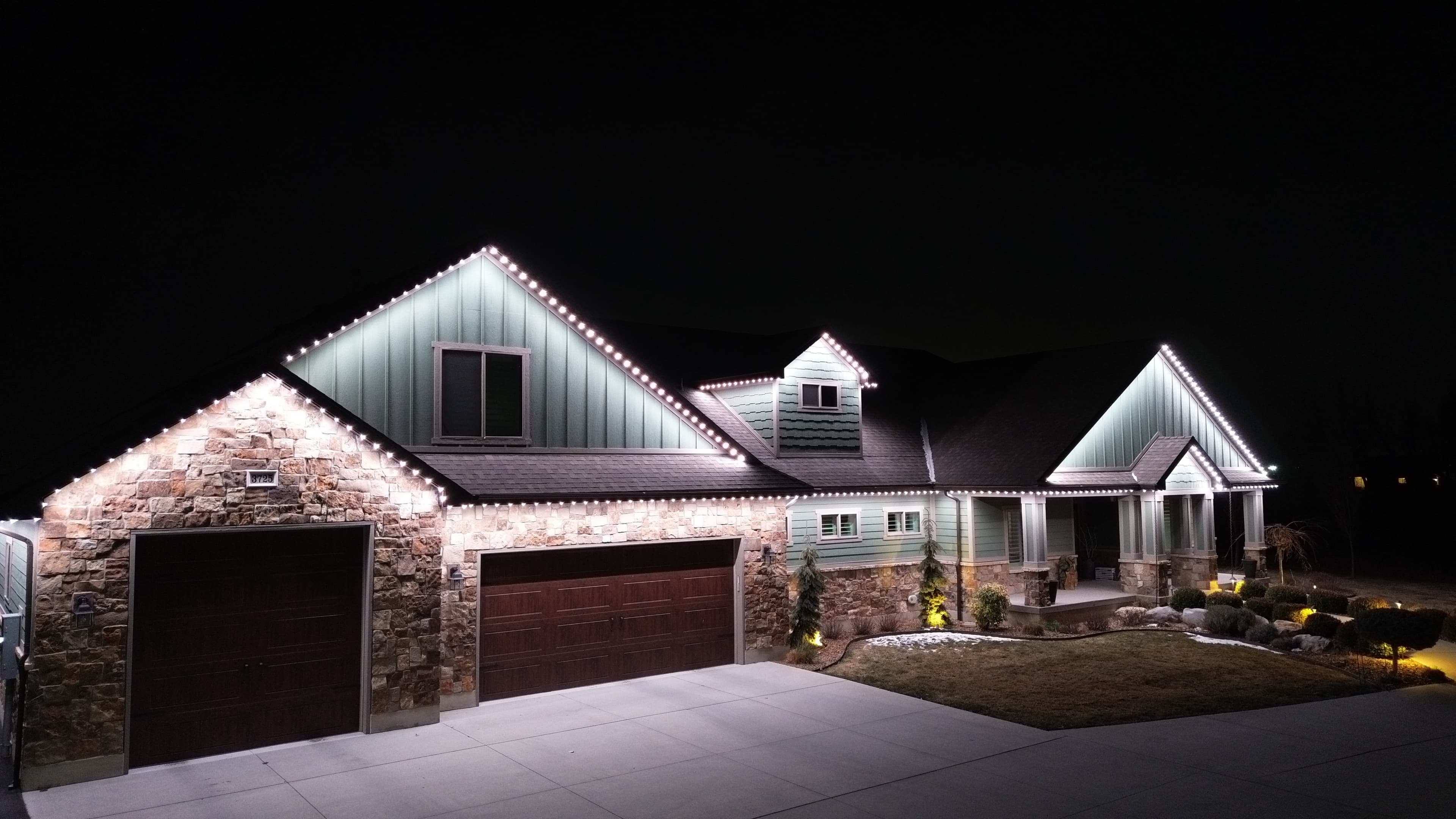 Security lighting illuminating a northern Utah home at night