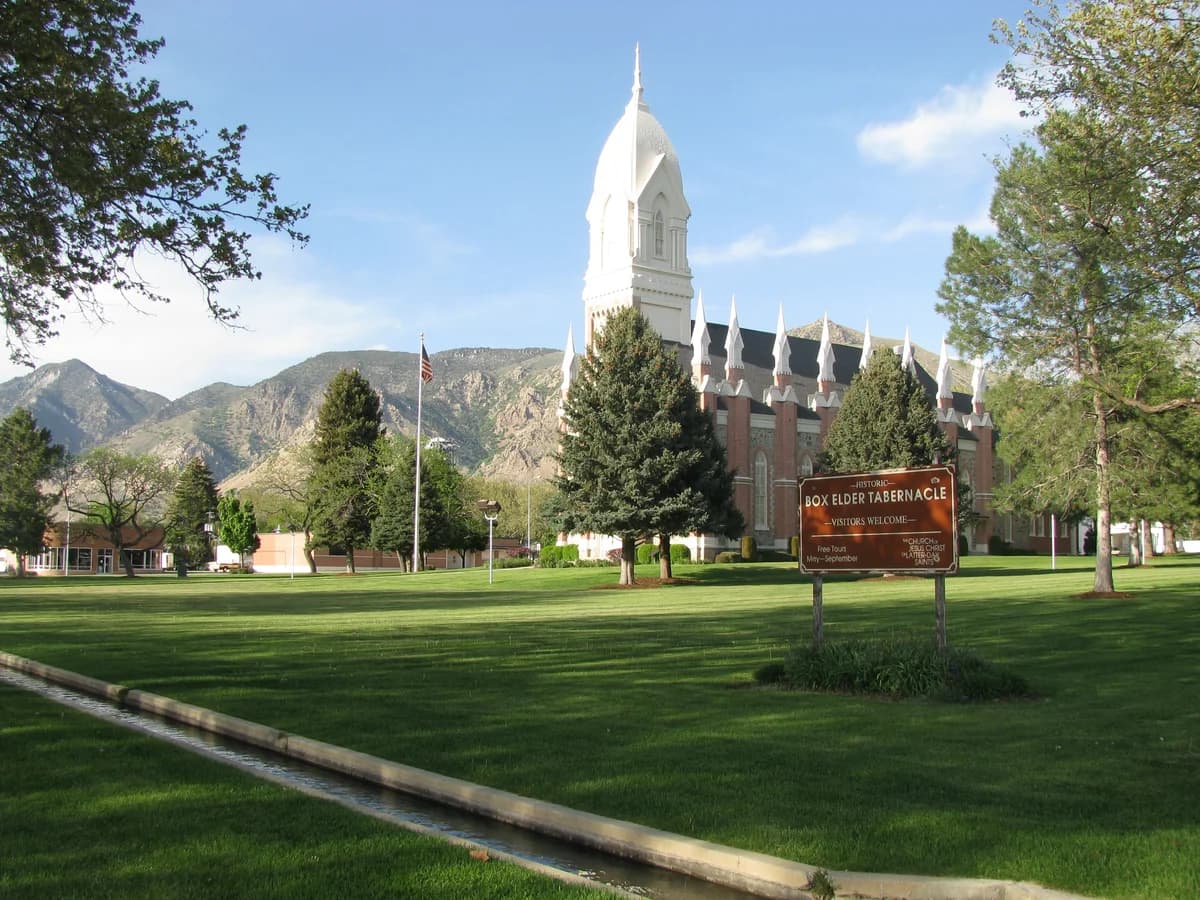 Box Elder Tabernacle with the mountains behind it.